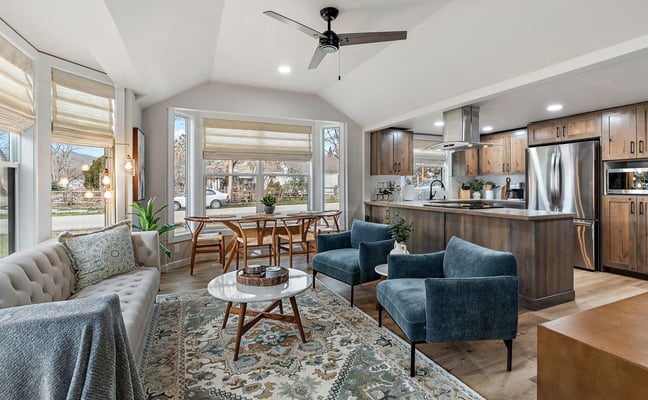 Beautifully designed vacation rental living room with mid-century furniture and desert-toned accents